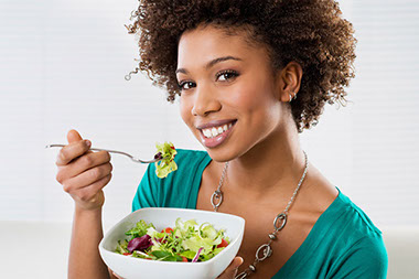 Image of women eating a healthy salad. Image of women eating a healthy salad.