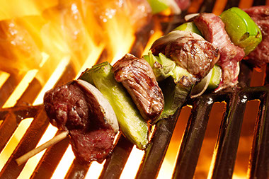 Image of meat being grilled.