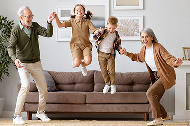 Grandparents playing with their grandchildren.