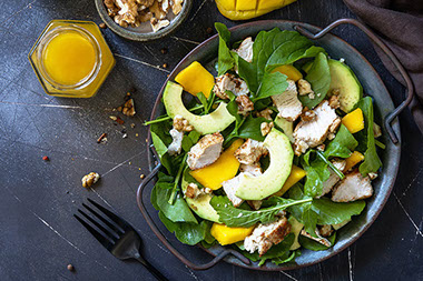 Salad with walnuts, mangos, chicken and avocado. Salad with walnuts, mangos, chicken and avocado.