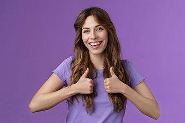 Simling women with 2 thumbs up.
