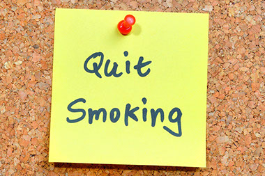 Image of note with 'Quit Smoking' written on it.