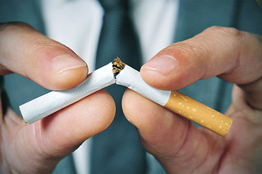 Image of cigarette being broken in half.