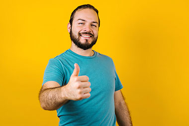 Smiling man with thumbs up. Smiling man with thumbs up.