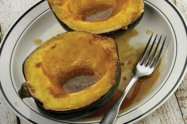 Orange honeyed winter squash on plate. Orange honeyed winter squash on plate.