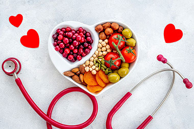 Heart shape plate with heart healthy foods.