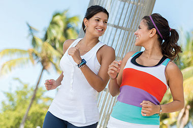 Two women power walking together.