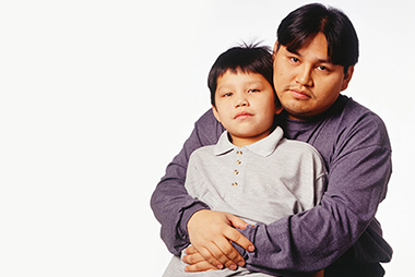 When bad things happen. Image of father hugging son.