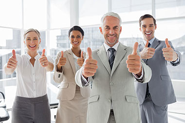 Image of employees with thumbs up. Image of employees with thumbs up.