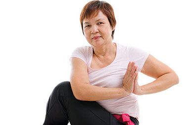 Five things to know about yoga. Image of women in yoga position.