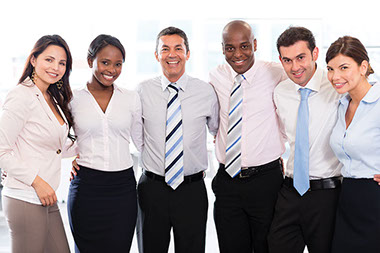 8 ways to be promotable. Image of a group of co-workers smiling.