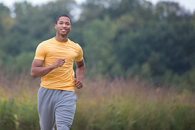 Image of male jogging outside.