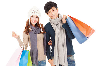 Image of couple holding shopping bags.