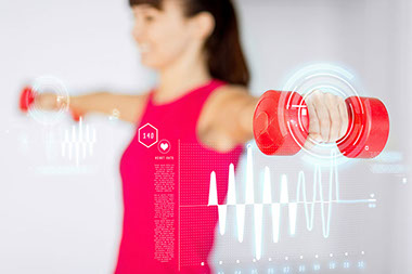 Woman hands with light red dumbbells. Woman hands with light red dumbbells.