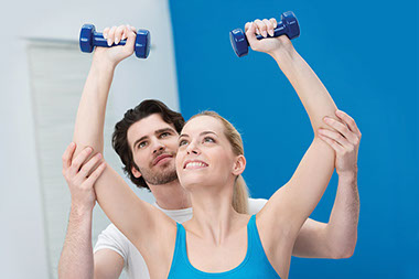 A shoulder to lean on. Image of women and trainer exercising the shoulders.