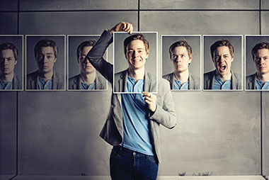 Image of hanging pictures showing the same man with different emotions.