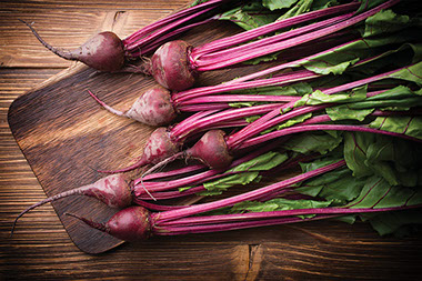 Nutritional treasure in the trash. Image of beets with the greens still attached.