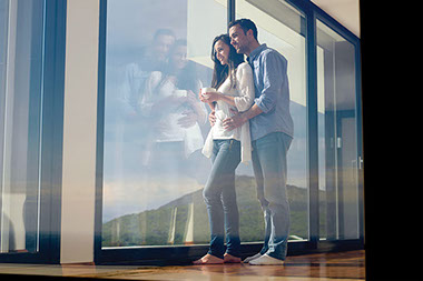 STIs and infertility. Image of couple looking out a window.