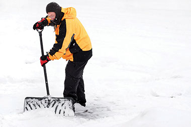 Image of man shoveling snow.