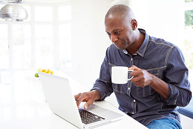 10 foods that reduce stress. Image of man drinking a cup of coffee.