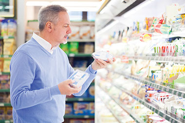 Image of older man grocery shopping.