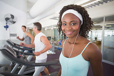 Image of women at gym using the treadmill.