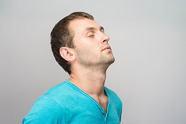 Image of man deep breathing.