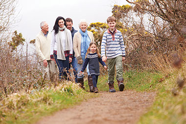 Family walking along a trail. Family walking along a trail.