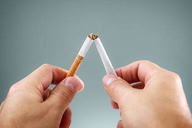 Image of cigarette being broken in half.