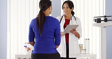 Image of female doctor with female patient.