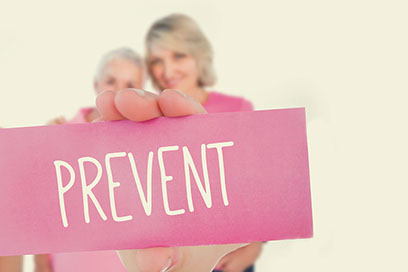 Image of 2 women holding a sign with the word "Prevent" written.