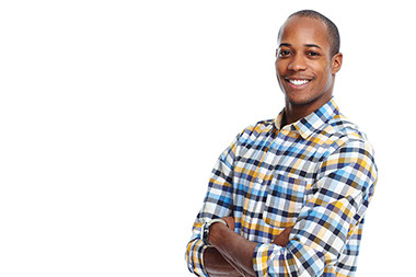 Smiling man with arms crossed.