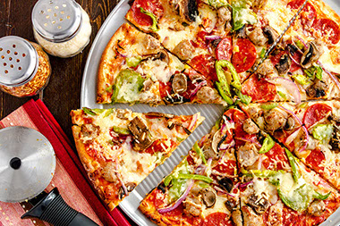 Frozen pizza with added fresh vegetables.