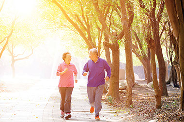Image of older couple brisk walking.
