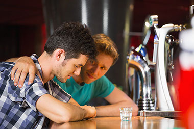 Codependency Image of 2 friends at a bar.