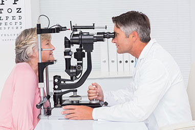 Image of mature women receiving an eye exam.