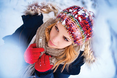 Be ready for winter. Image of warm dressed women outside in winter.