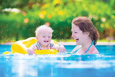 Image of mother and young child in the pool.