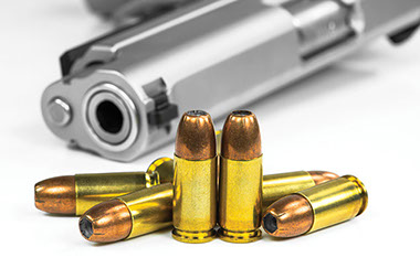 Image of gun and bullets.