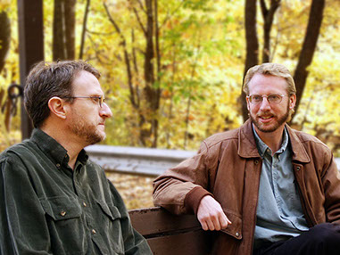 Image of two friends talking.