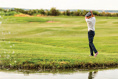 Image of man playing golf.