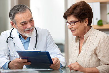 Image of doctor and patient talking.