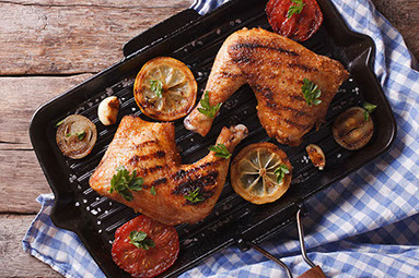 Cooked meat, chicken, on grill pan.