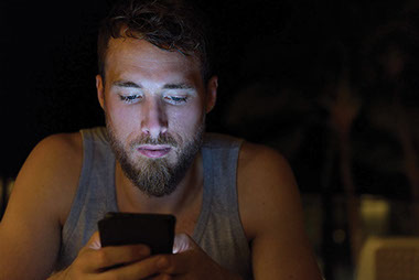 Man on phone late into the night.