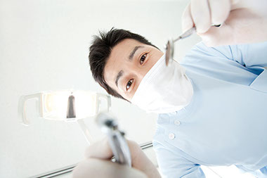 Open wide. Image of dentist.