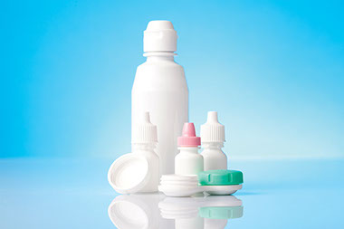 Image of contact solution, case and eye drops.
