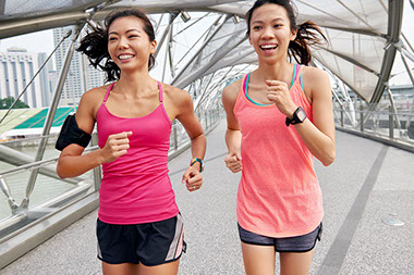 Two women enjoying a run together.