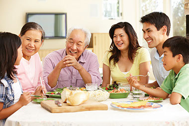 Family eating dinner together at home.