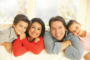 Image of smiling family.