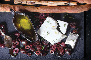 Olive oil, black oils, bread and cheese. Olive oil, black oils, bread and cheese.